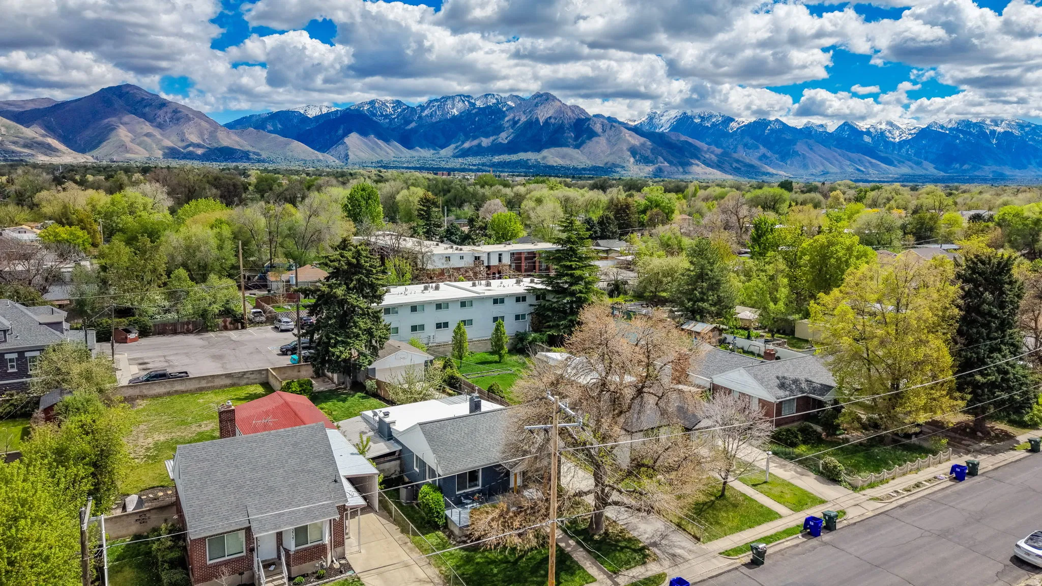 Aerial perspective of suburban area featuring a mountainous background