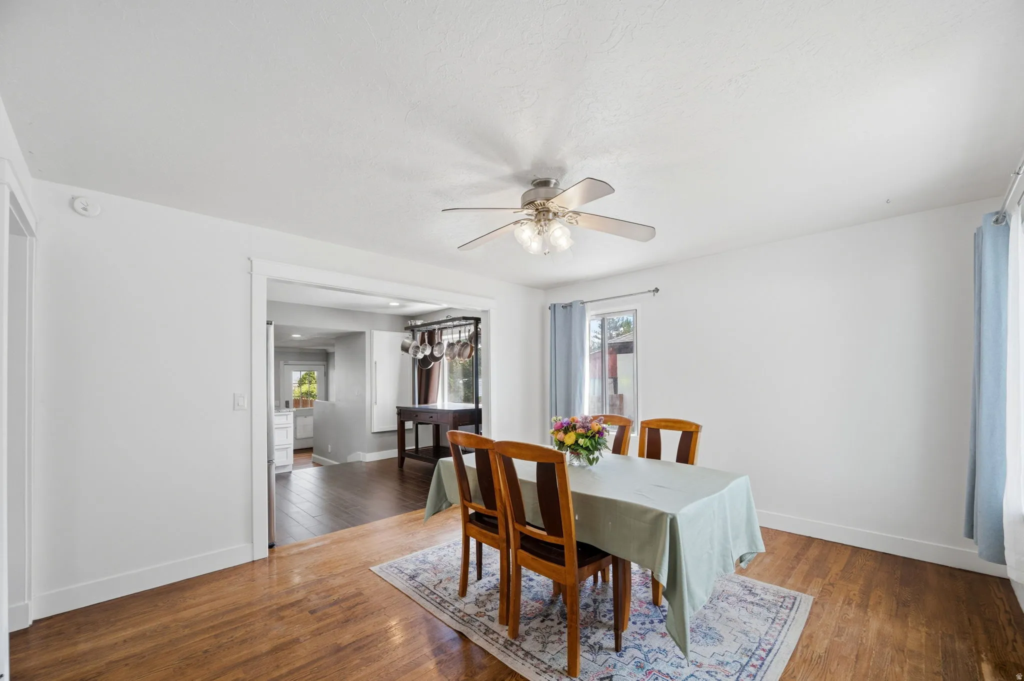 Dining area featuring hardwood / wood-style flooring and a ceiling fan