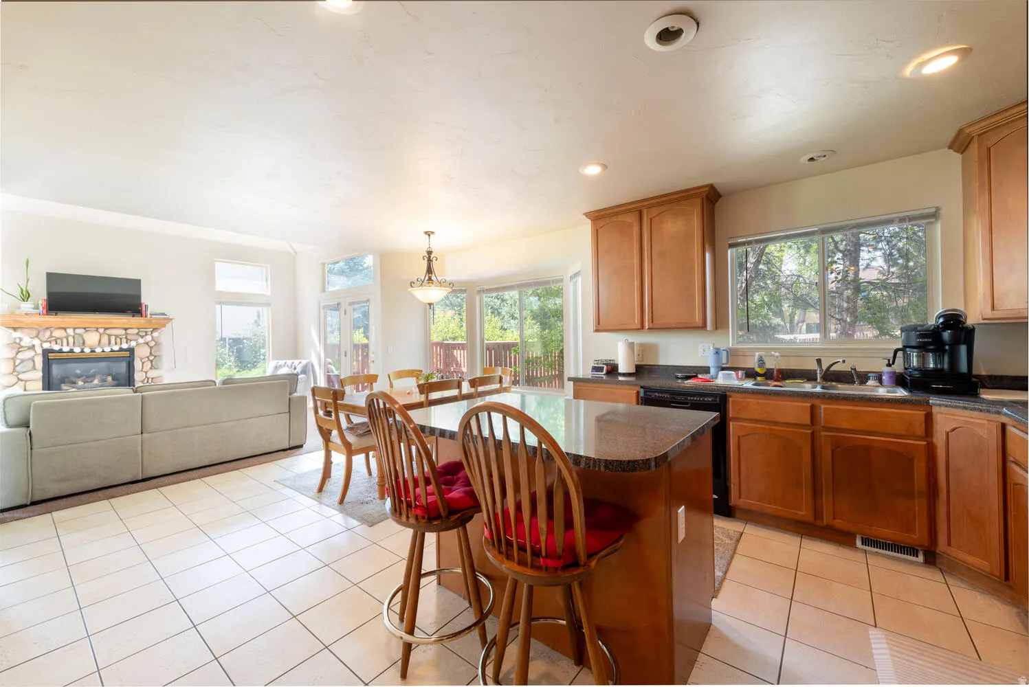 Open kitchen, dining, living room with lots of light