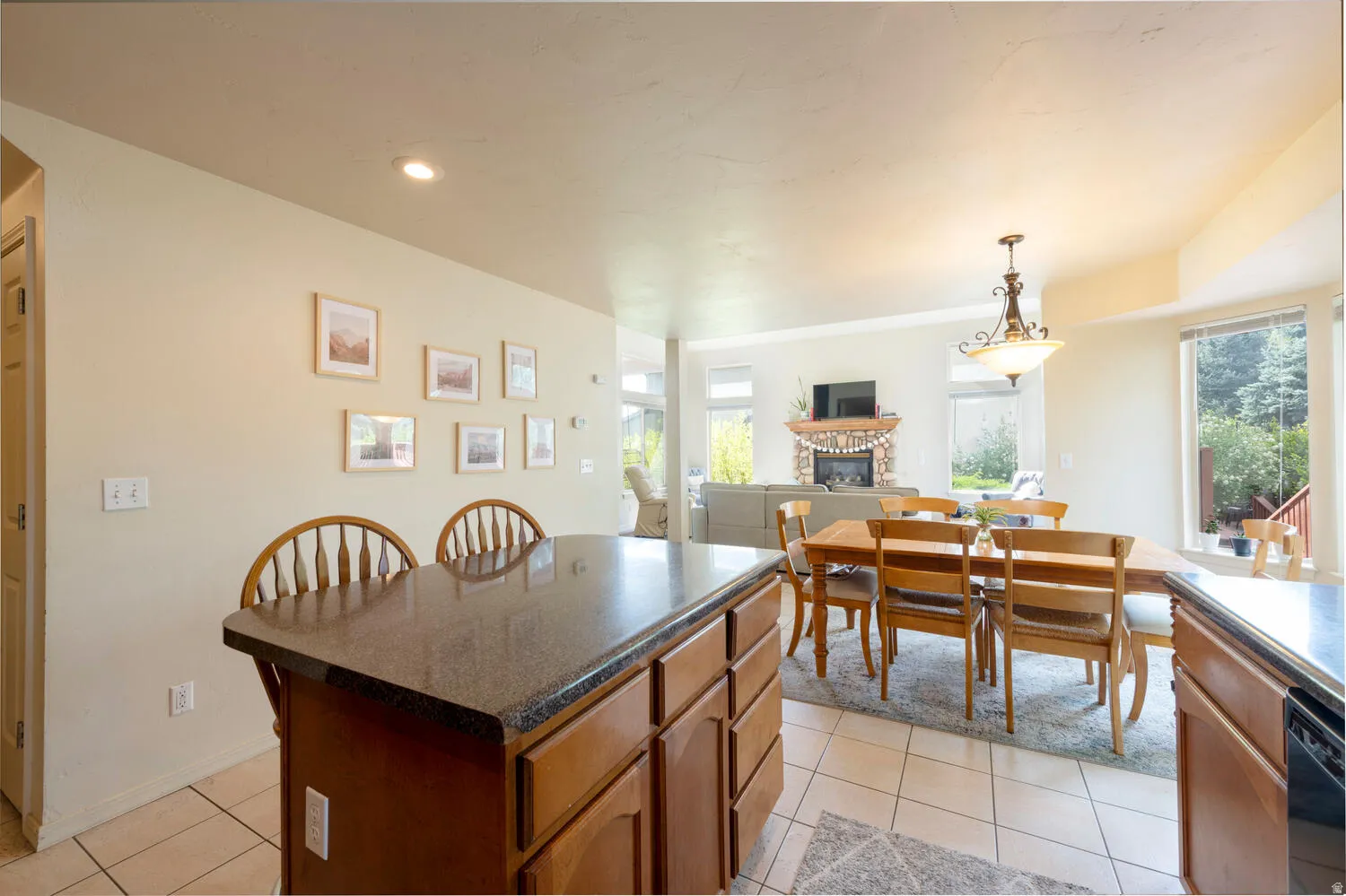 Kitchen looking back into dining area and living room