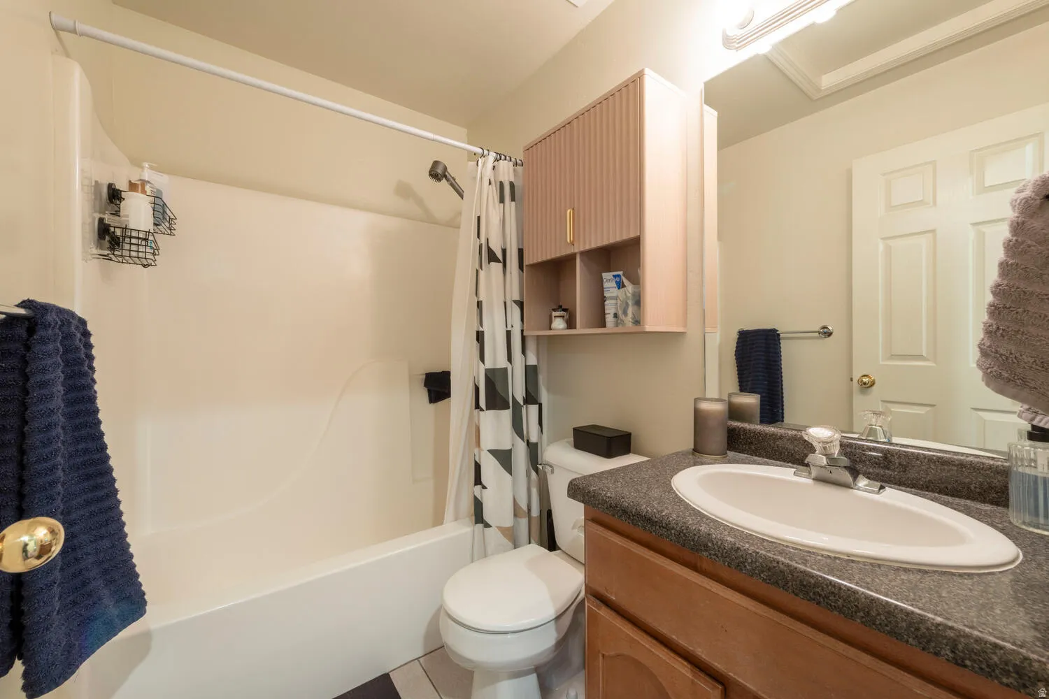 Bathroom with vanity and shower/tub combo