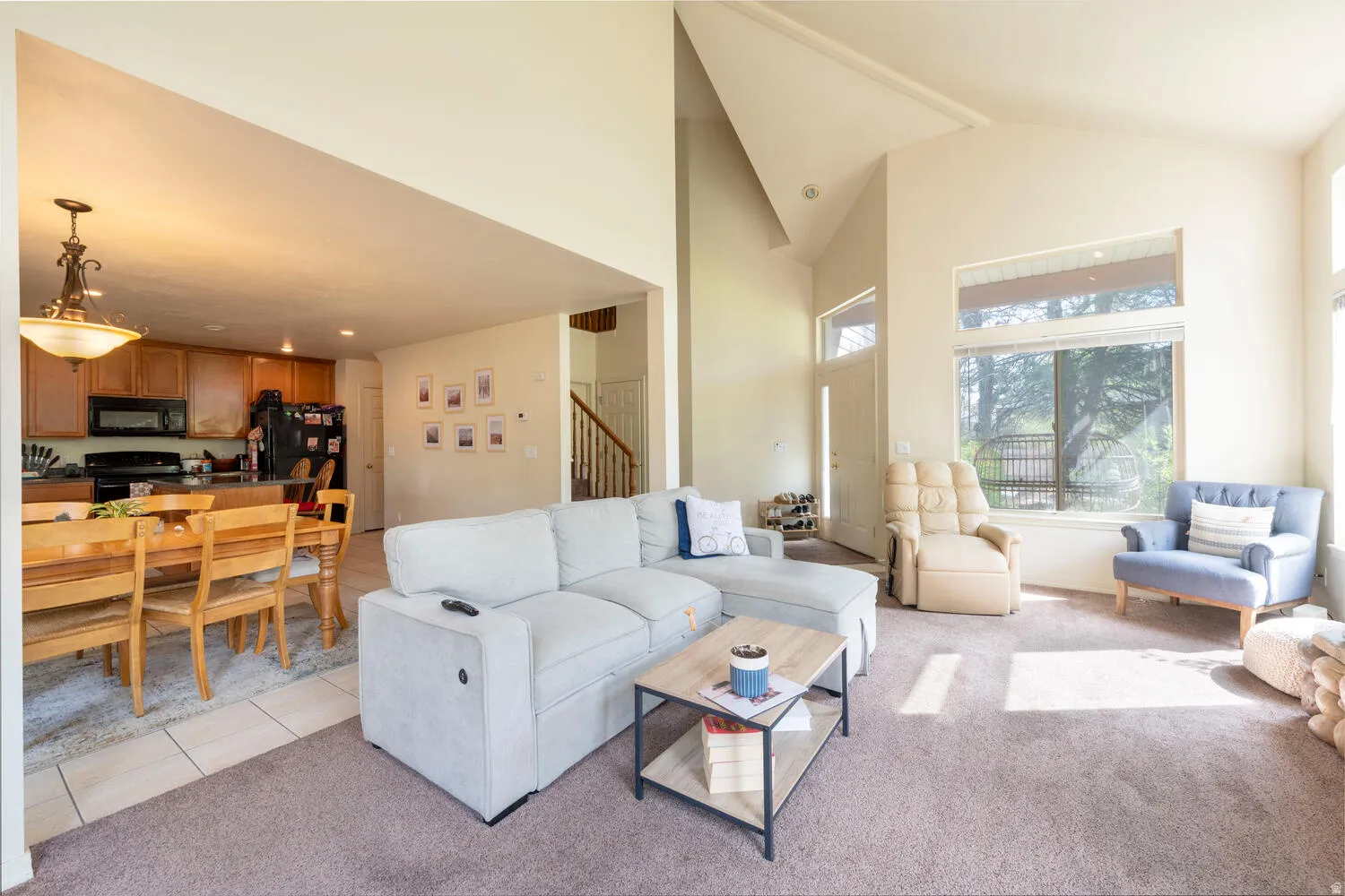 Open floor plan living room looking into dining area and kitchen