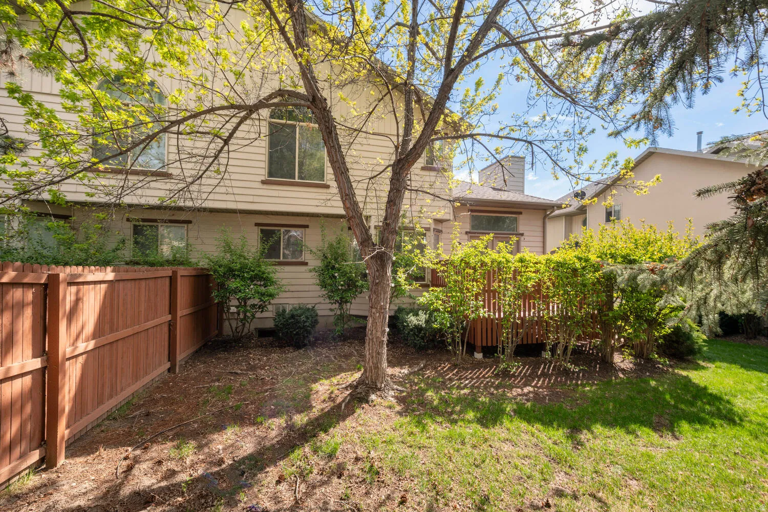 Rear view of 7494 with deck and backyard
