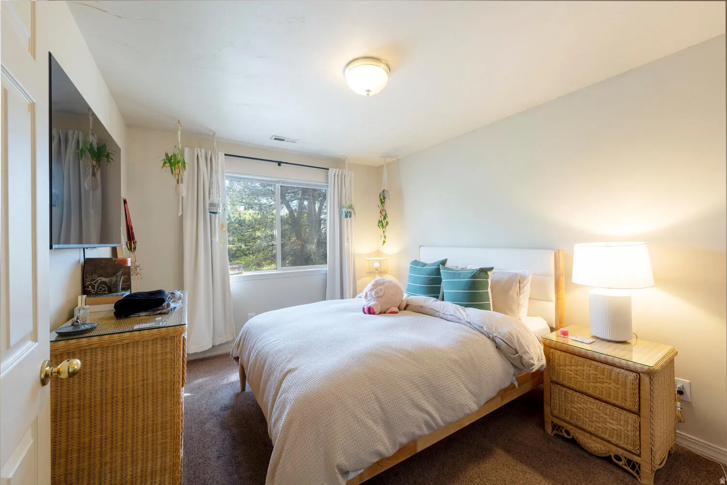 Bedroom featuring carpet floors and baseboards