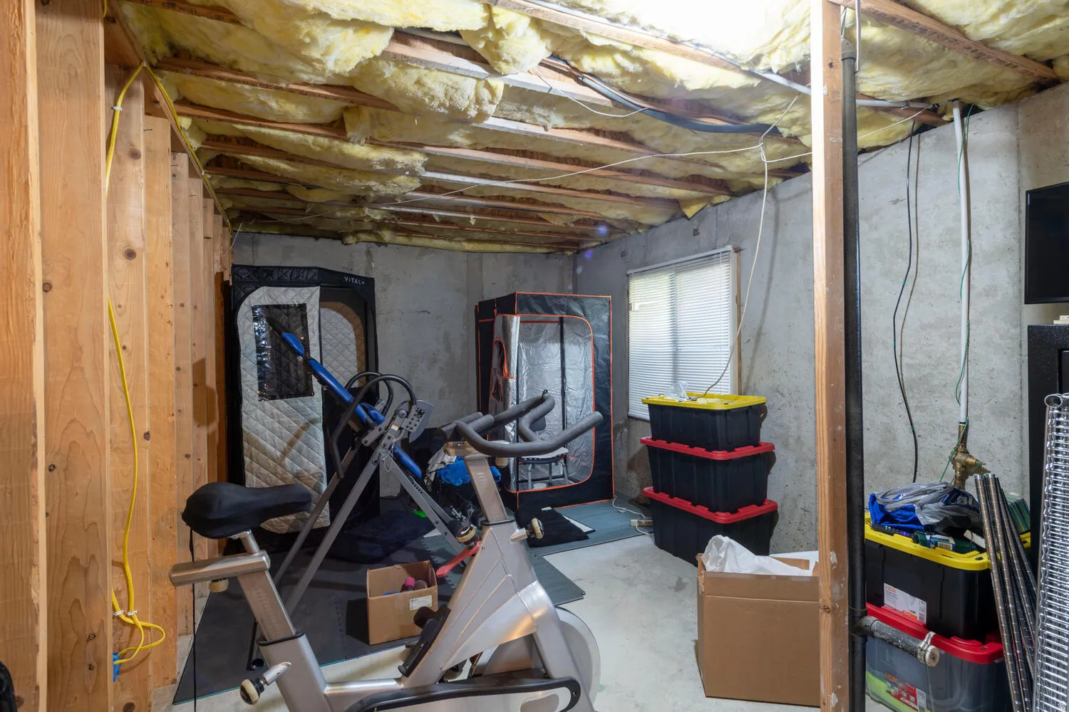 Workout room featuring concrete floors