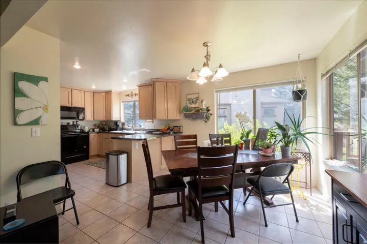 Dining area off of living area and with view of the kitchen