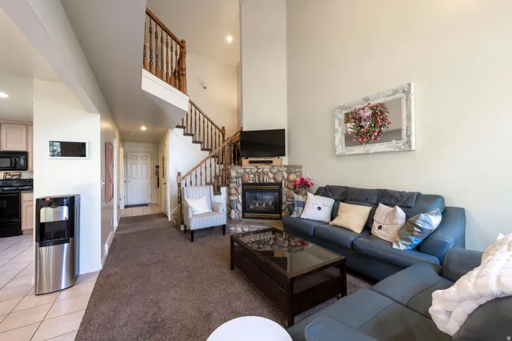 Living area with view of dining area and staircase in the background