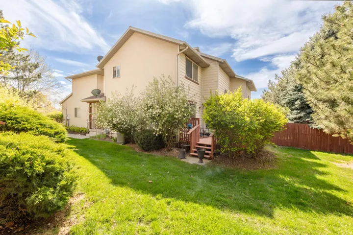 Rear view of house featuring a deck