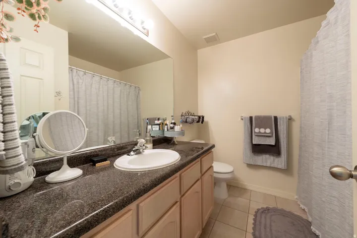 Hall full bath featuring a shower