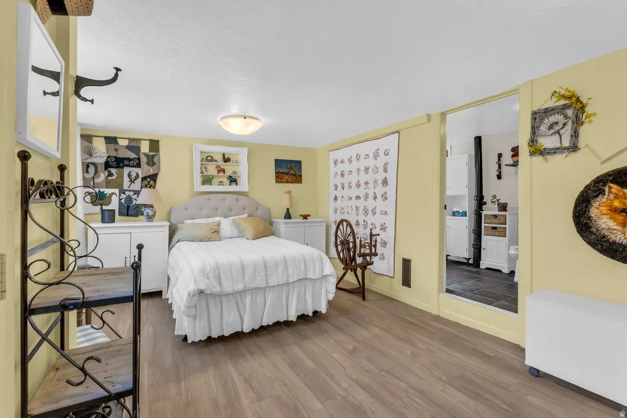 Bedroom featuring wood finished floors and baseboards