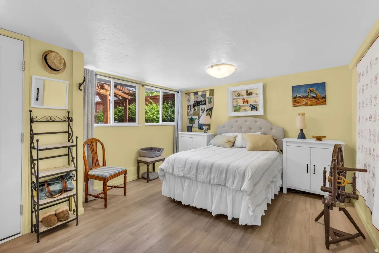 Bedroom featuring light wood-style floors and baseboards