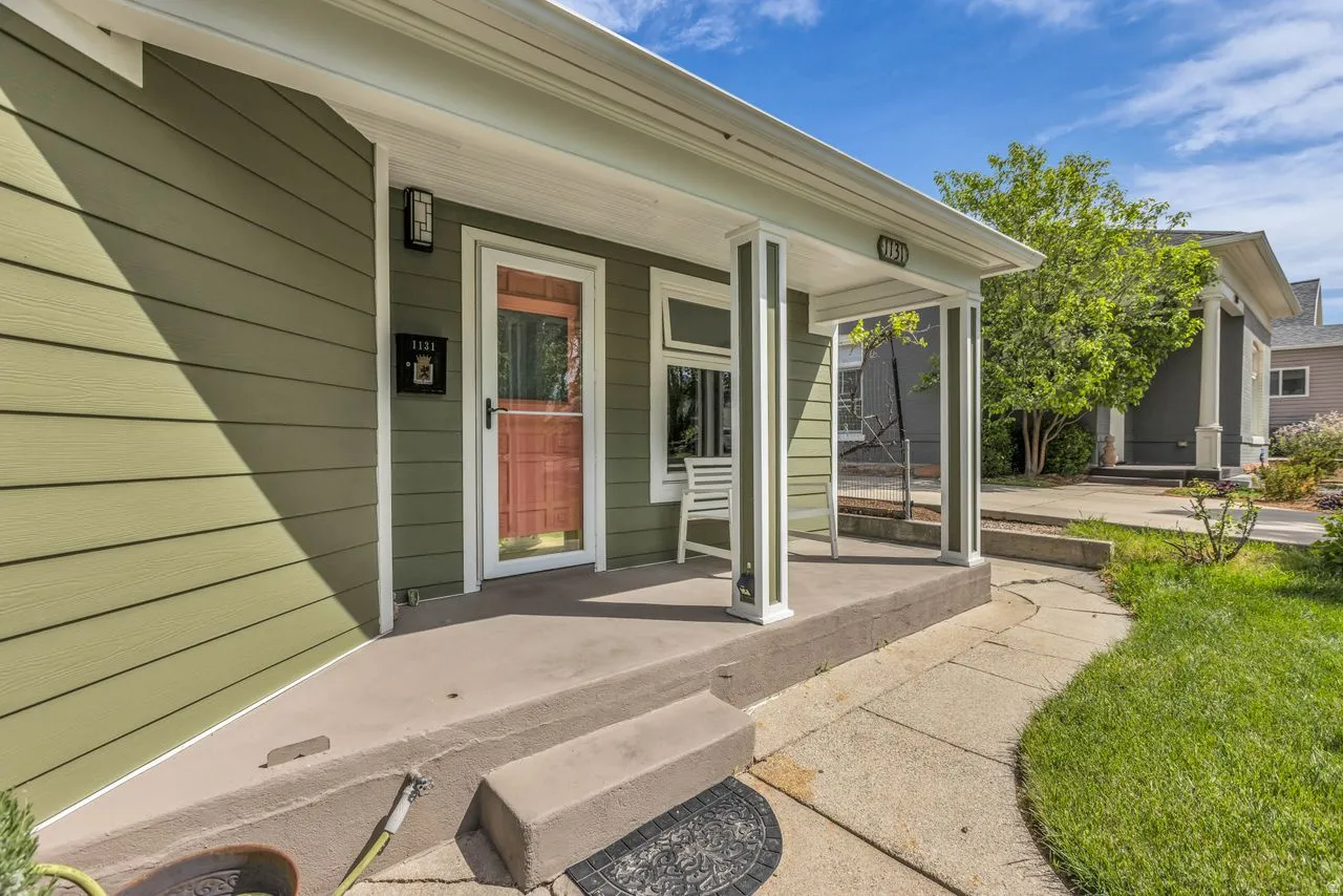Doorway to property featuring a porch