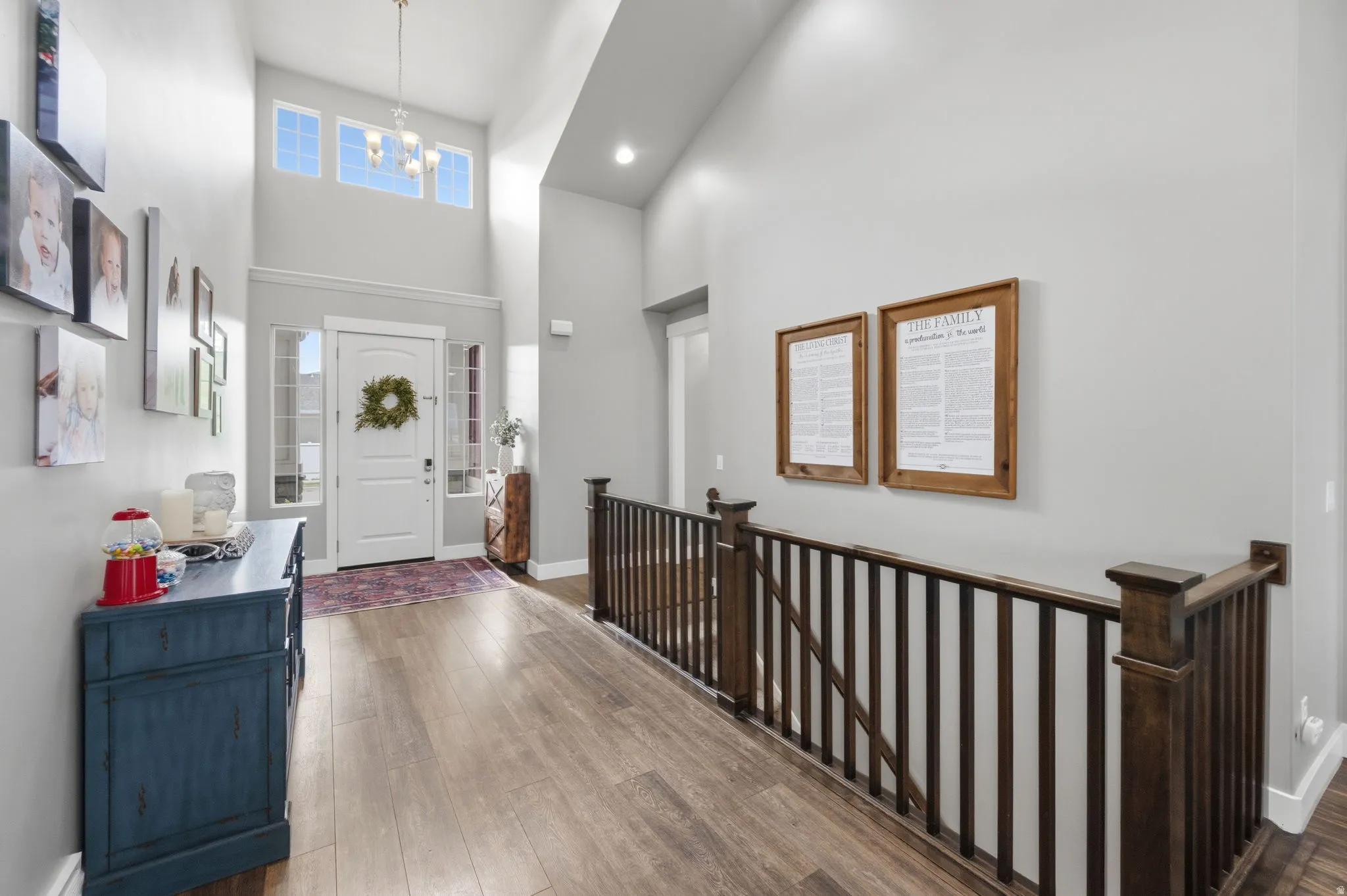 Entryway featuring hardwood / wood-style flooring and vaulted ceilings