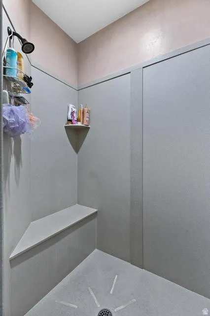 Full bath with a tile shower