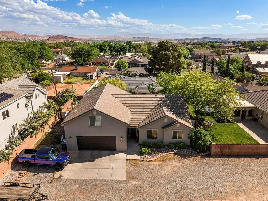 Aerial perspective of suburban area featuring a mountainous background