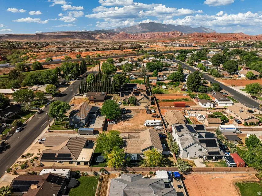 Aerial perspective of suburban area with a mountainous background