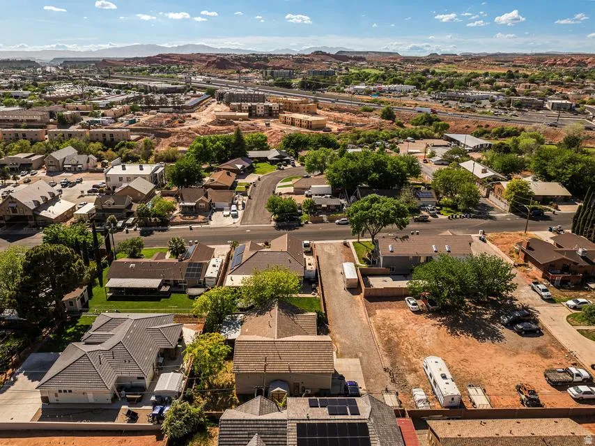 Aerial perspective of suburban area with a mountain backdrop