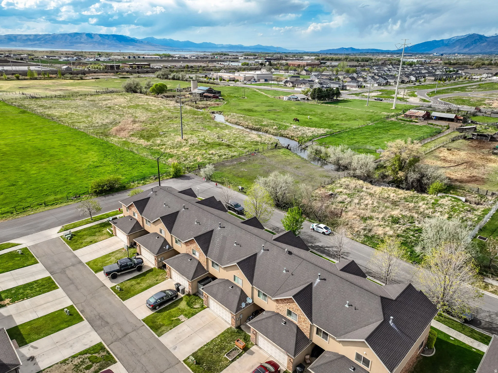 Aerial perspective of suburban area featuring a mountainous background