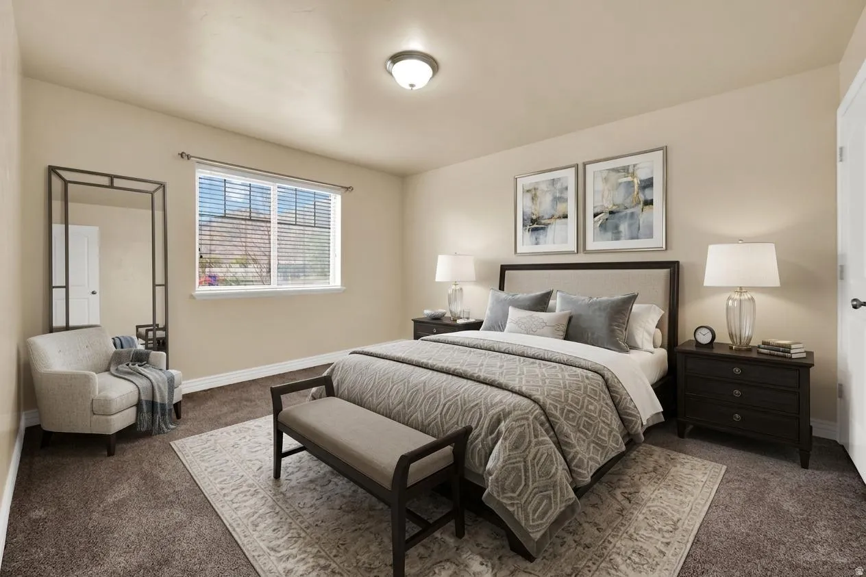 Bedroom with dark colored carpet