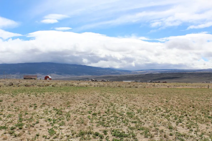 View of mountain background featuring rural landscape