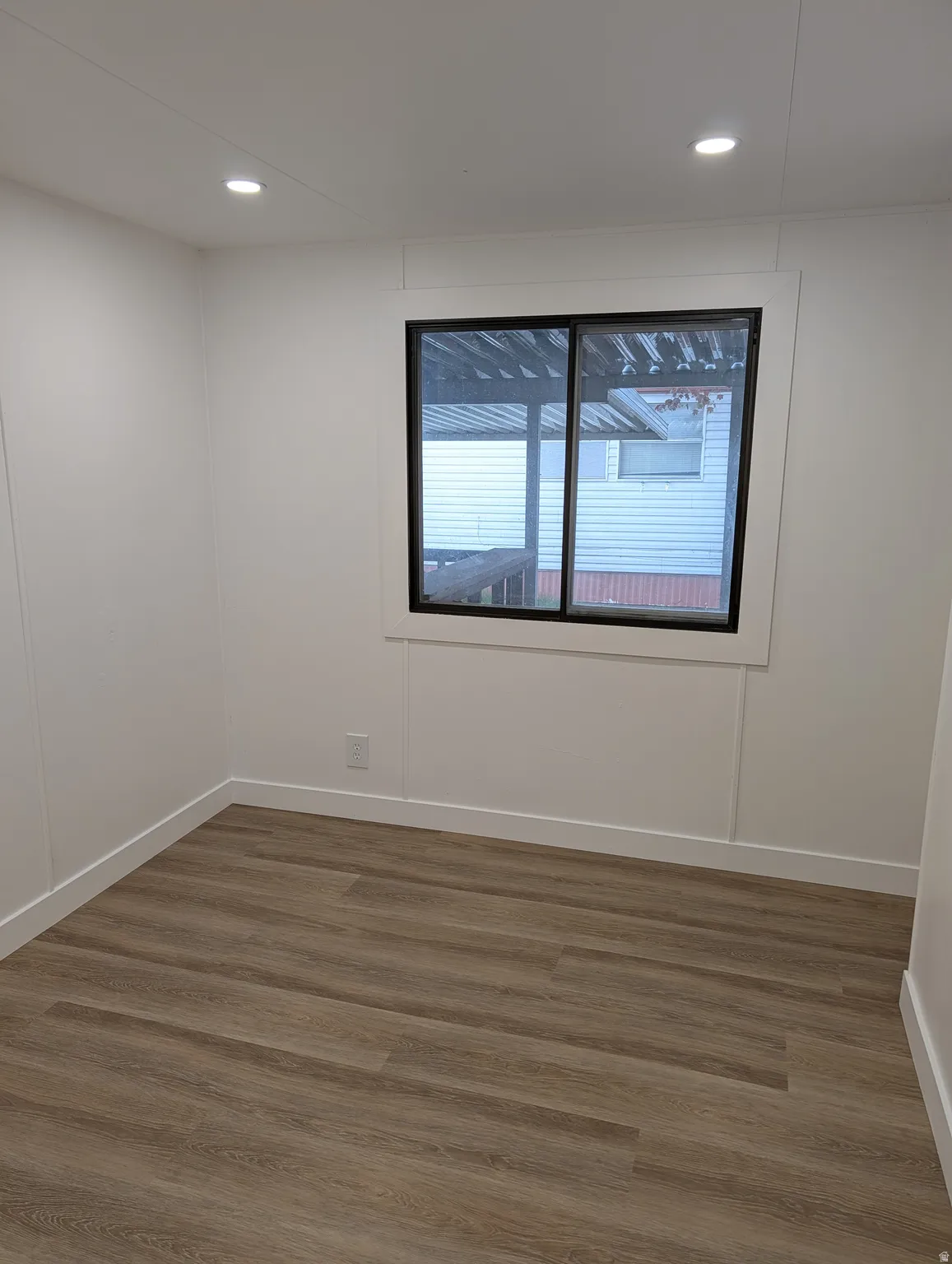Smaller bedroom with recessed lighting