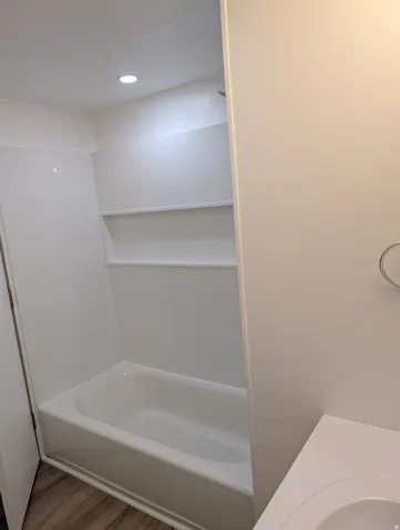 Full bathroom with vanity, bathtub / shower combination and recessed lighting