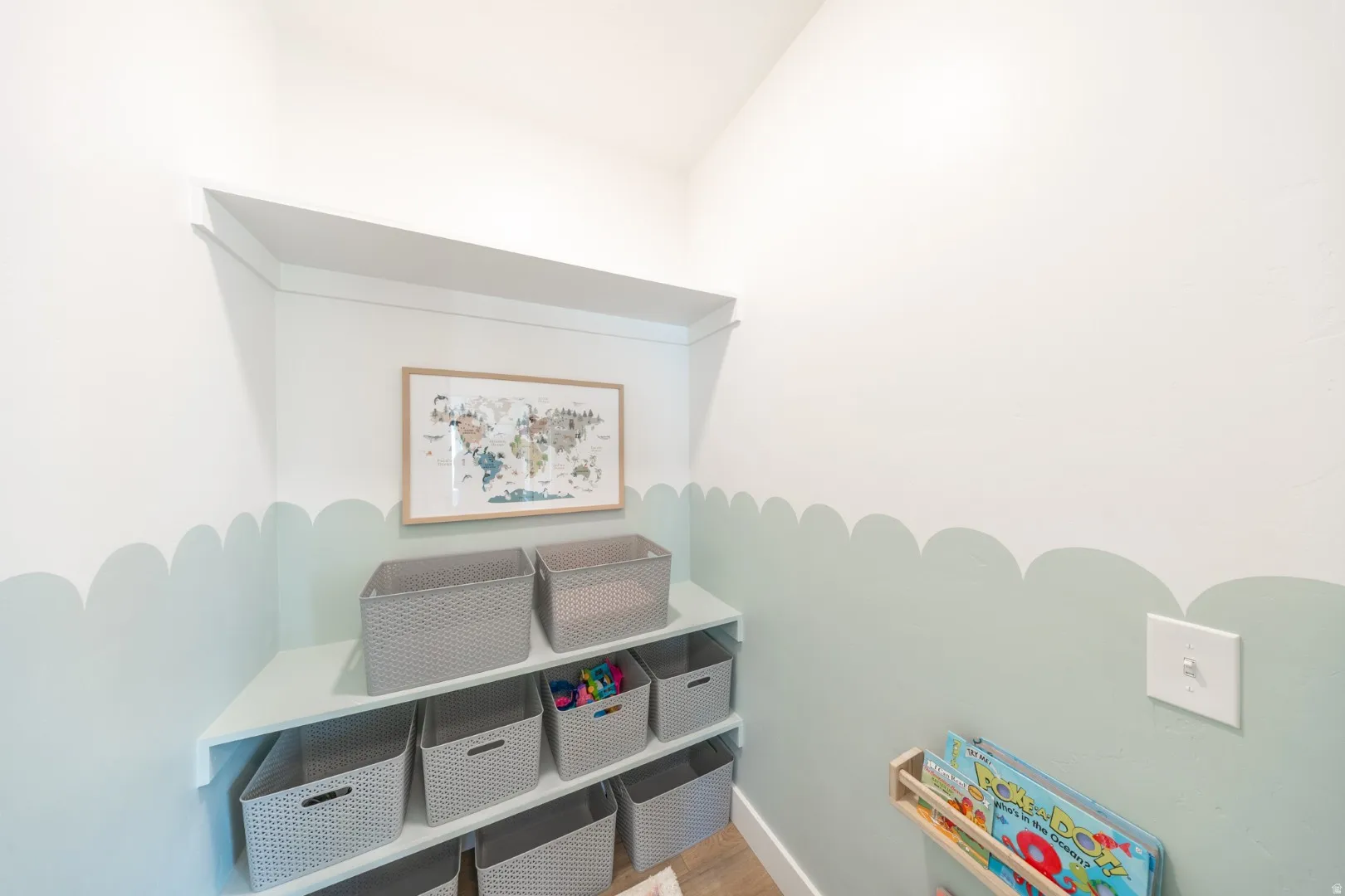 Game room featuring baseboards and wood finished floors