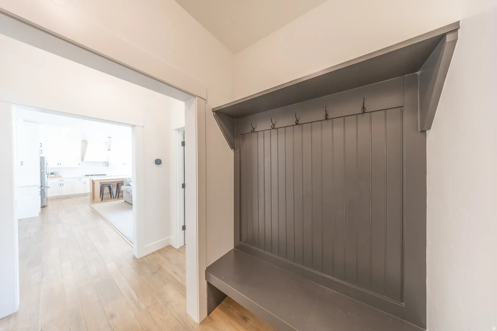 Mudroom featuring light wood finished floors