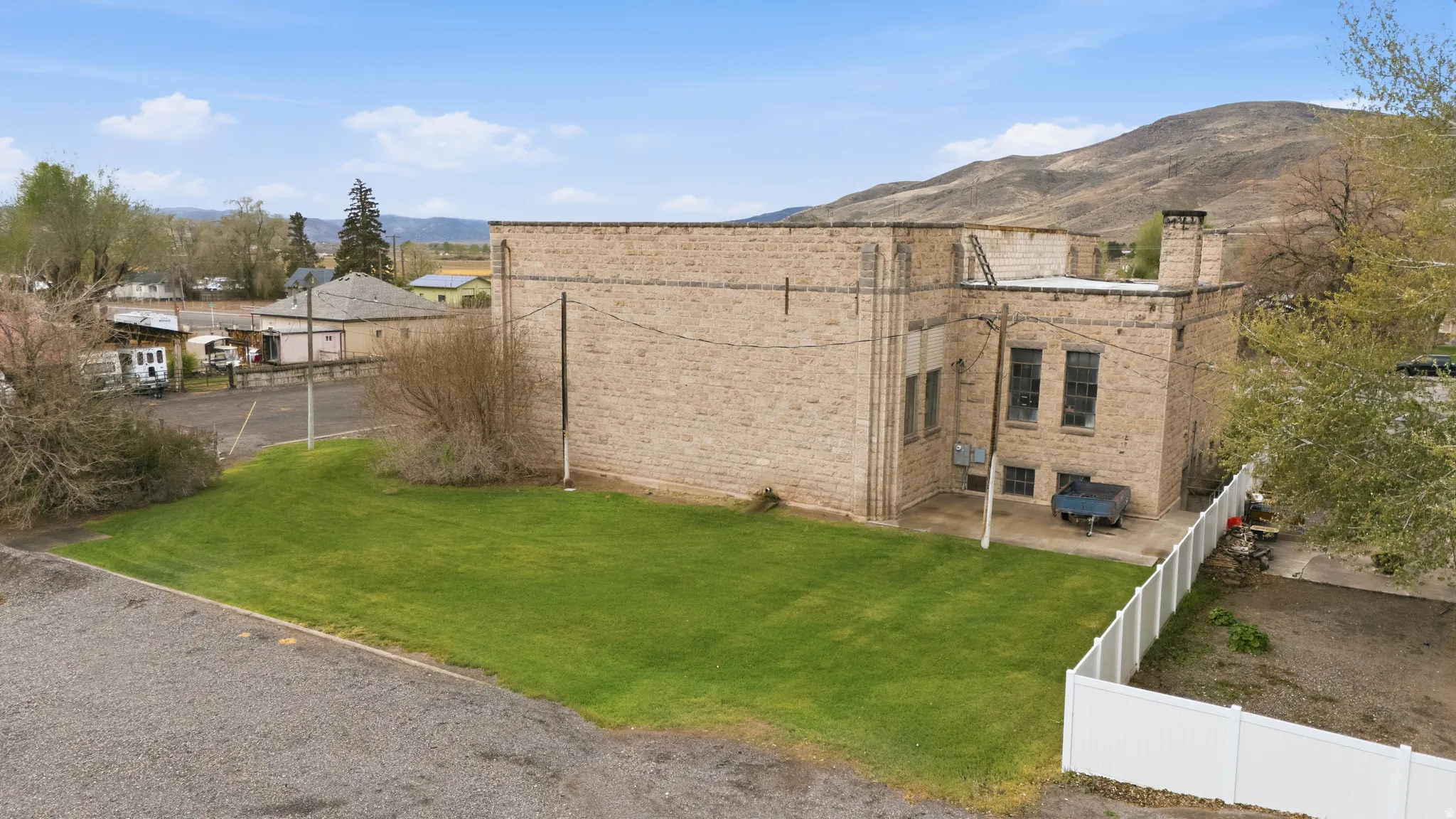 View of yard with a patio and a mountain view
