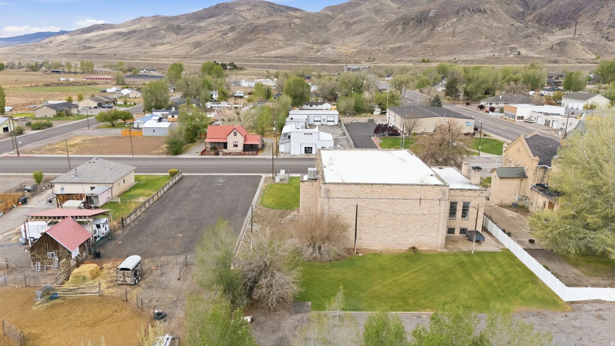 Aerial perspective of suburban area with a mountainous background