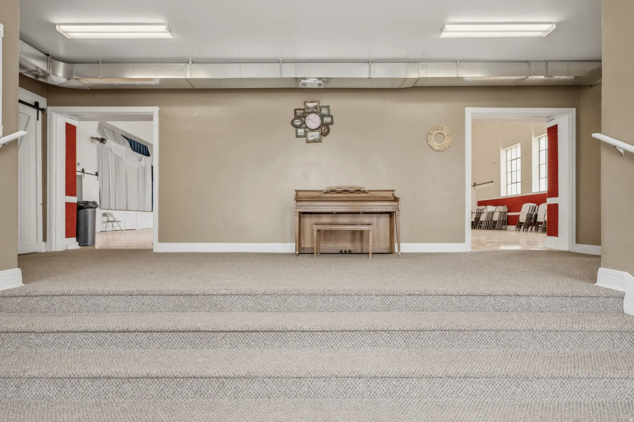 Staircase featuring carpet floors and a barn door