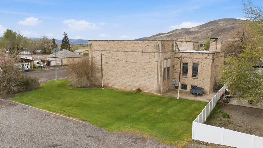 View of yard with a patio and a mountain view
