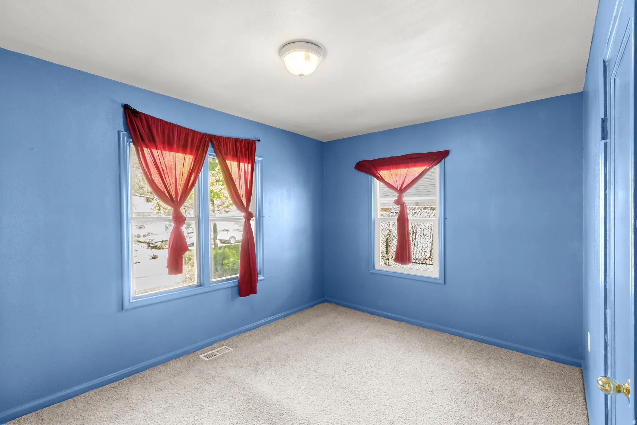 Unfurnished room with carpet floors and baseboards