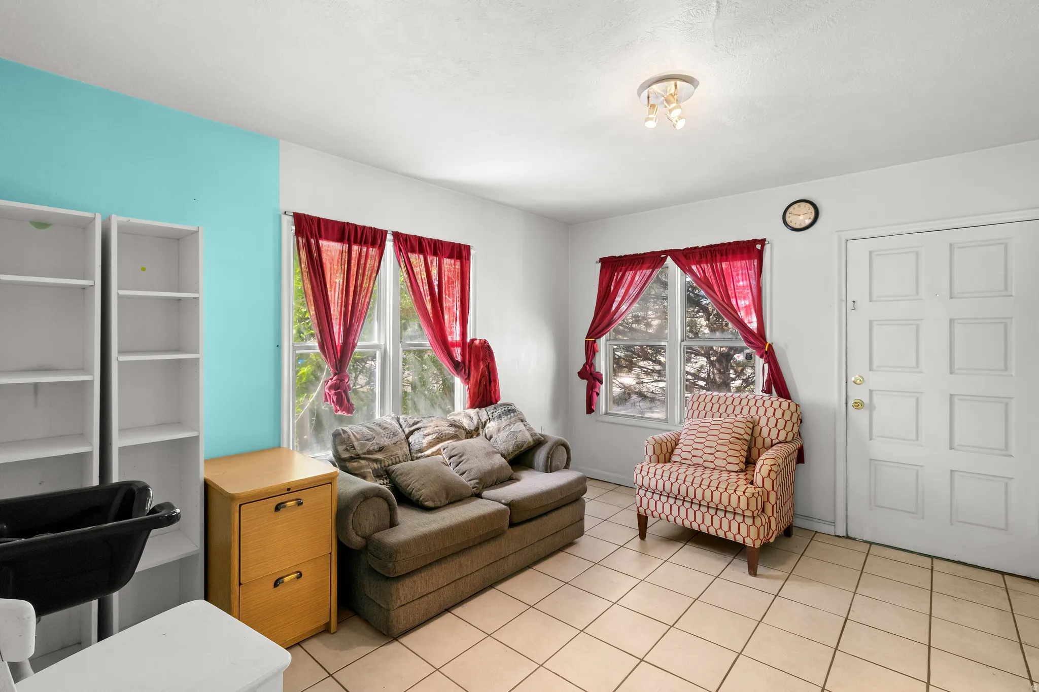 Living area with light tile patterned floors