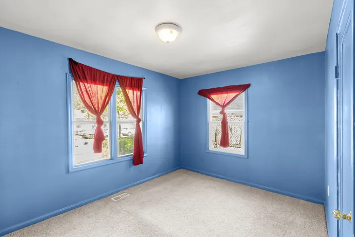 Unfurnished room with carpet floors and baseboards