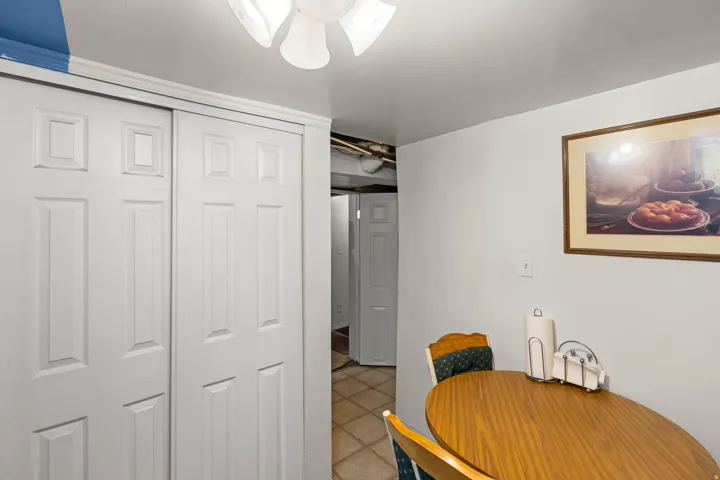 Dining room featuring light tile patterned floors and a ceiling fan