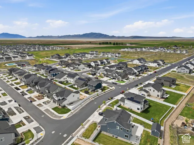 Aerial view of residential area with a mountainous background