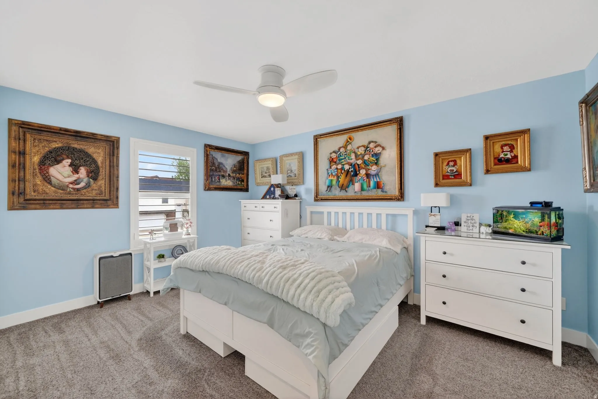 Bedroom featuring dark carpet and ceiling fan