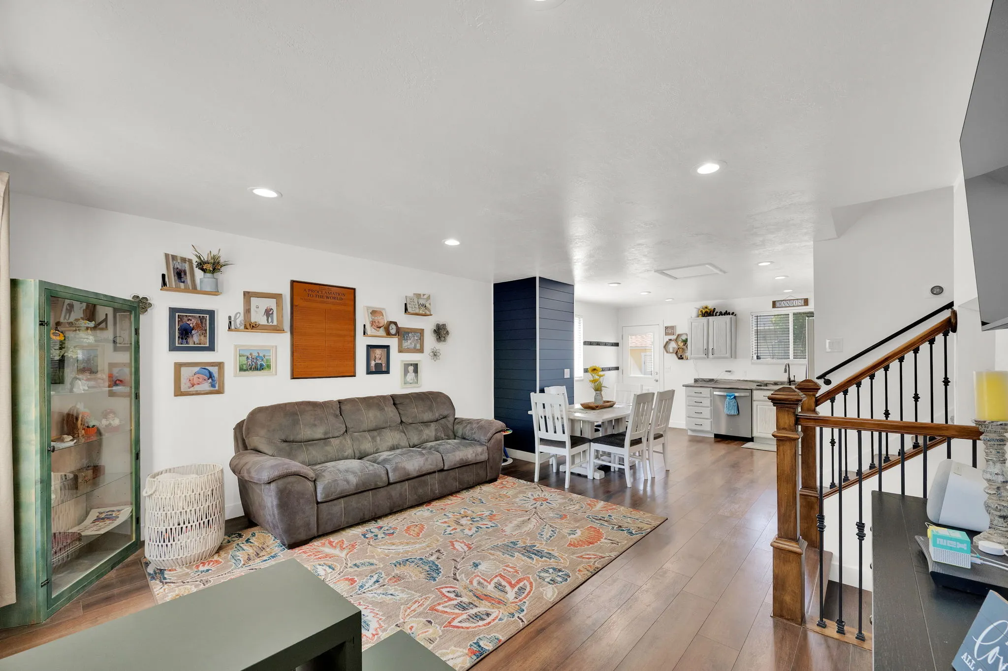 Living room with hardwood / wood-style flooring and recessed lighting