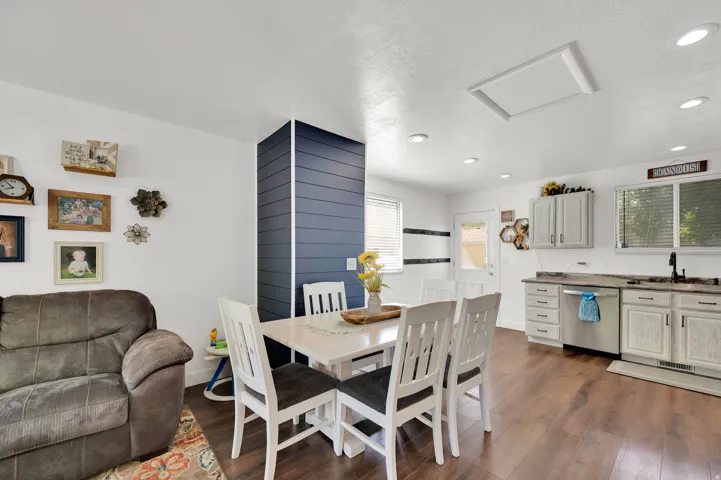 Dining area featuring dark wood finished floors and recessed lighting