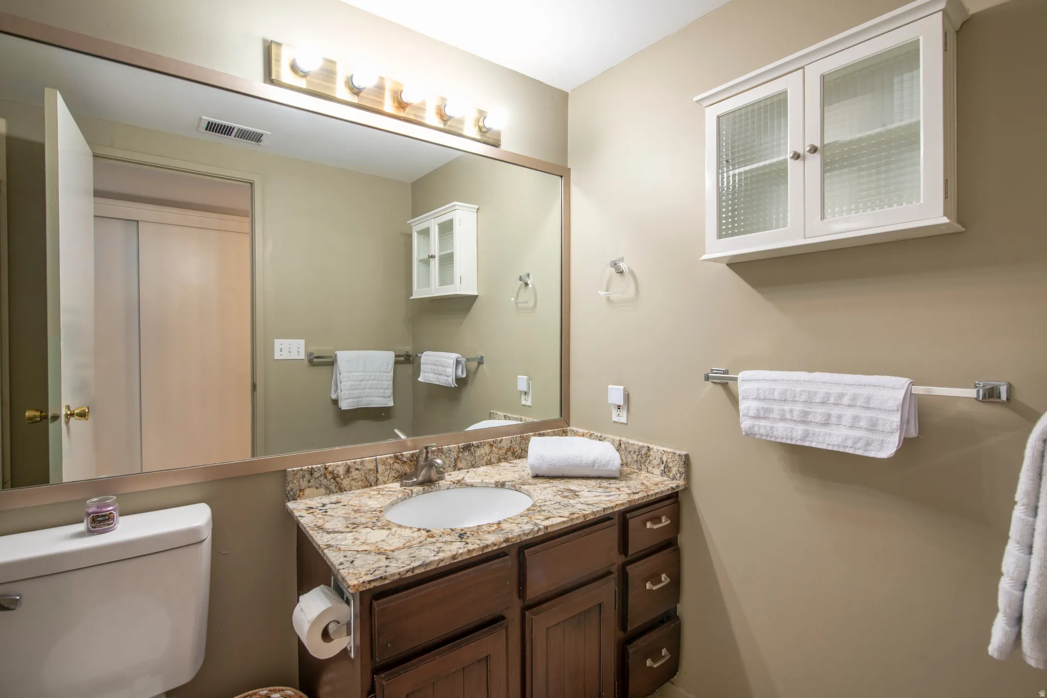Half bath with vanity and toilet