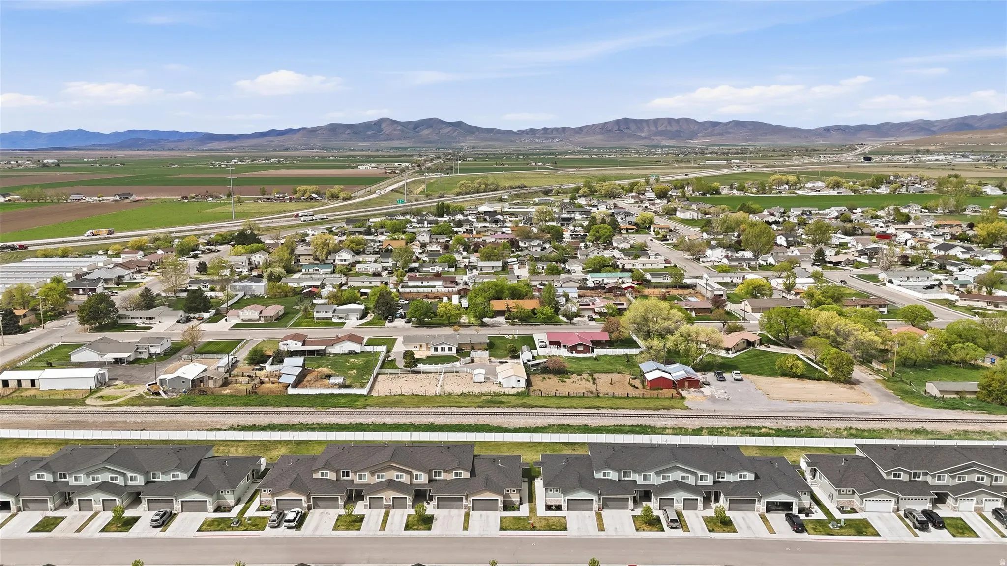 Aerial view of residential area featuring a mountain backdrop
