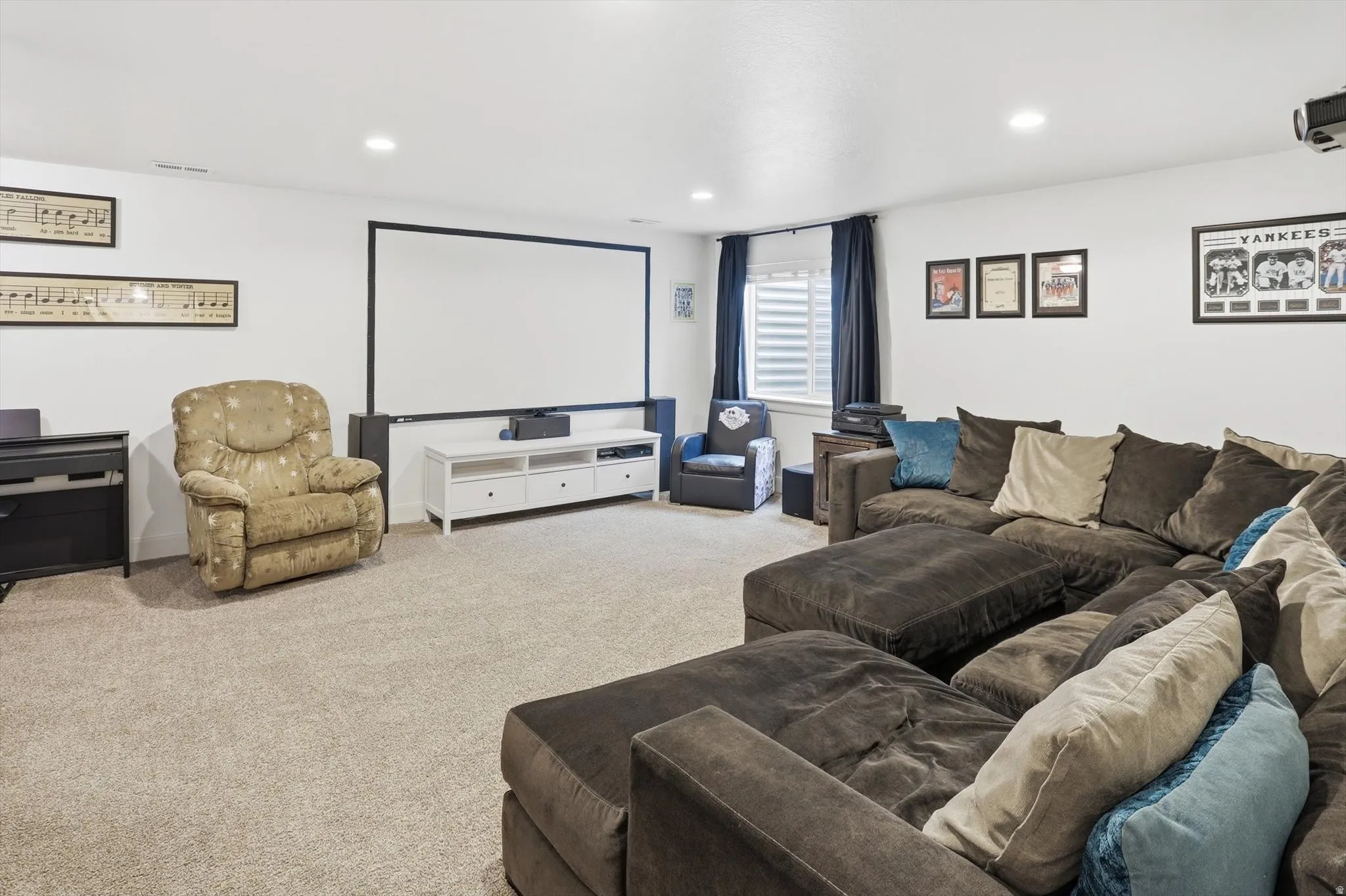 Carpeted cinema with recessed lighting