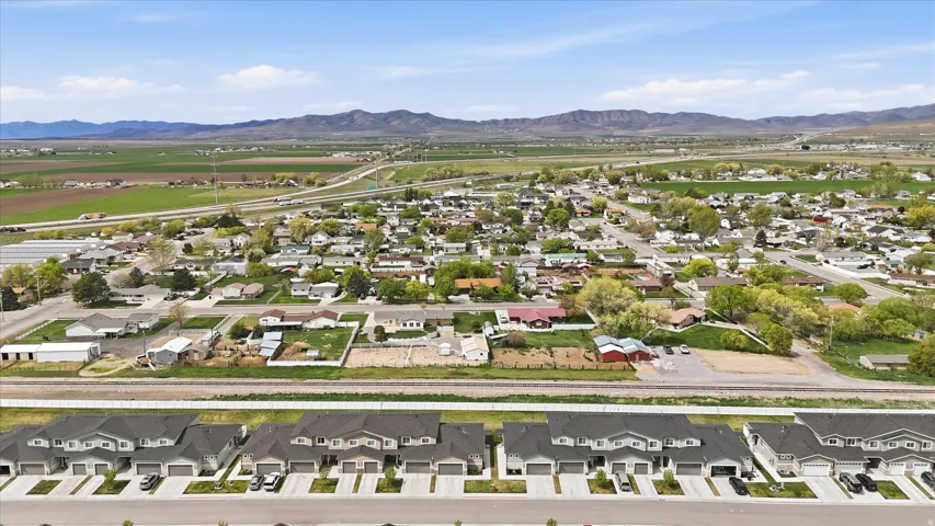 Aerial view of residential area featuring a mountain backdrop
