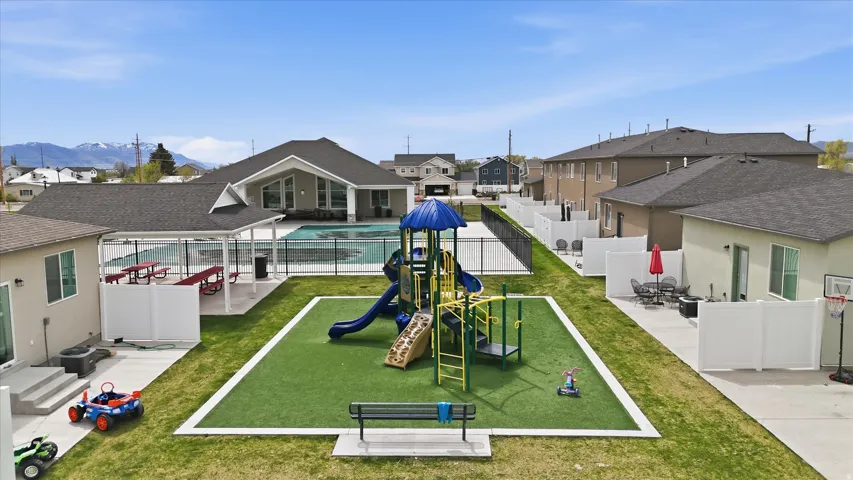 View of home's community featuring a patio area, a residential view, and a swimming pool