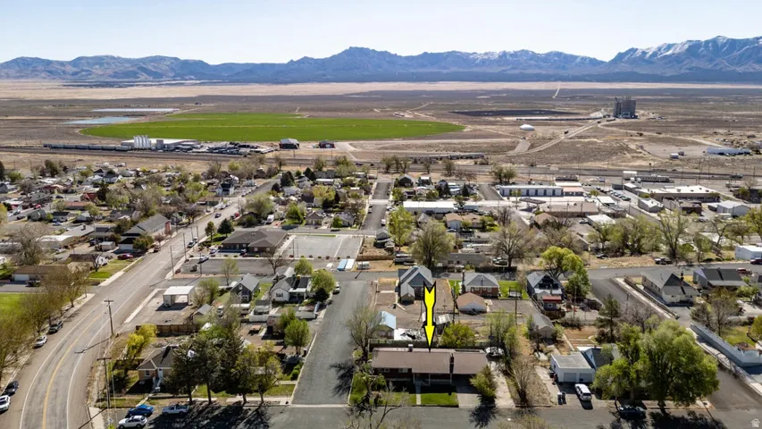 Aerial perspective of suburban area with a mountain backdrop