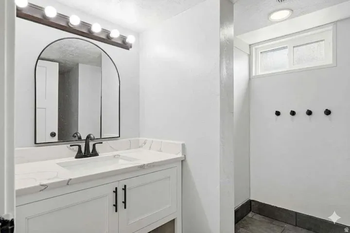 Bathroom featuring vanity and a textured ceiling