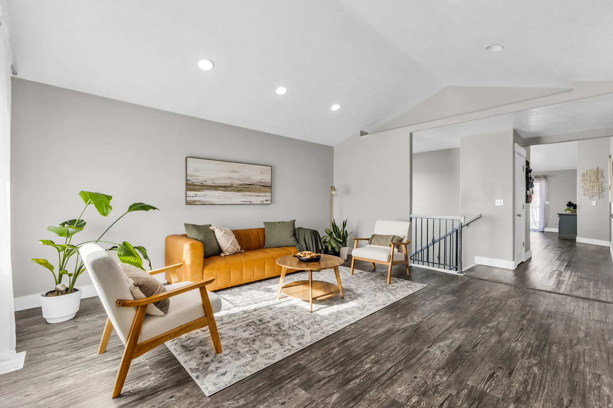 Living area with wood finished floors and recessed lighting