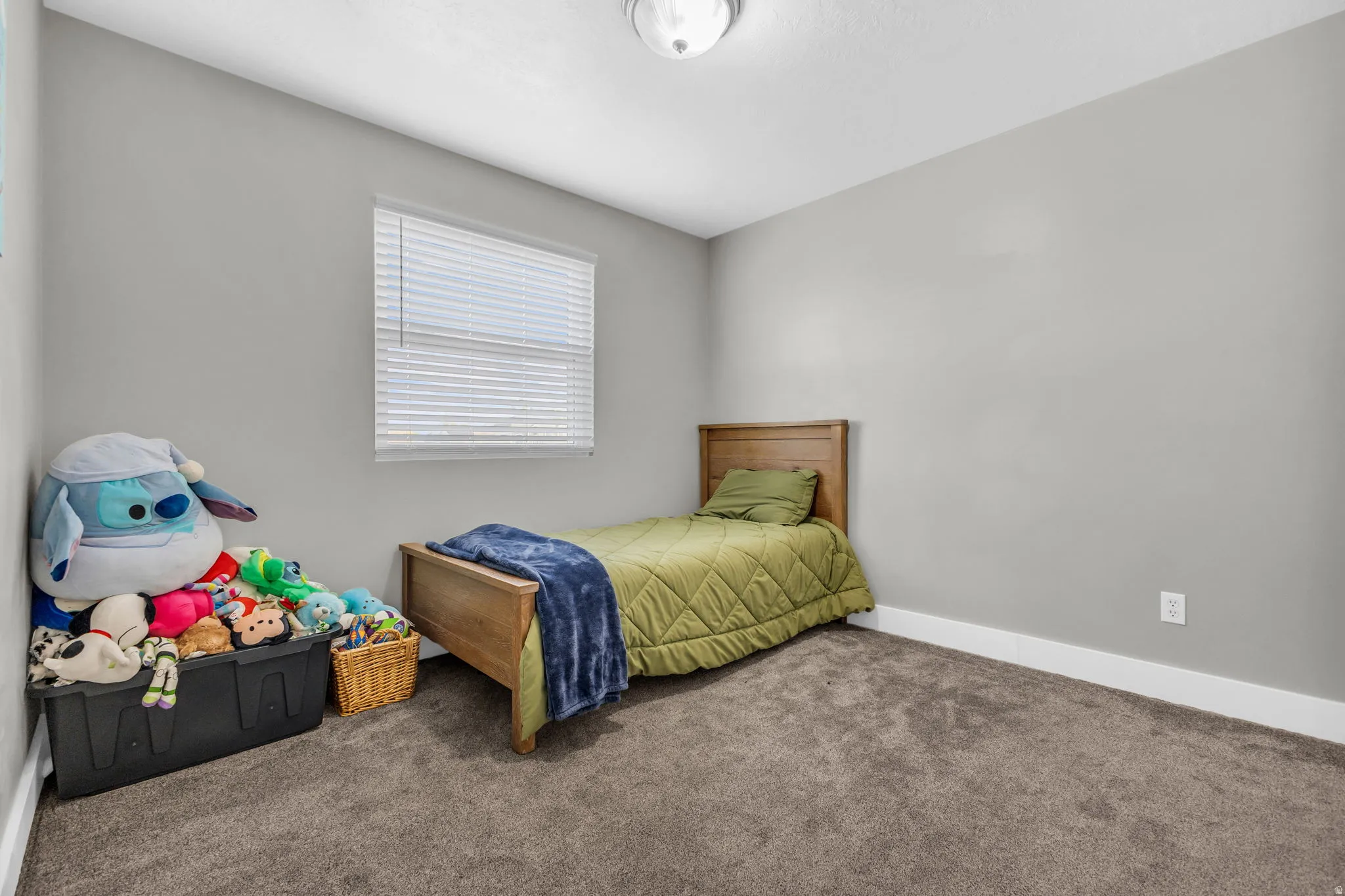 Bedroom with carpet and baseboards