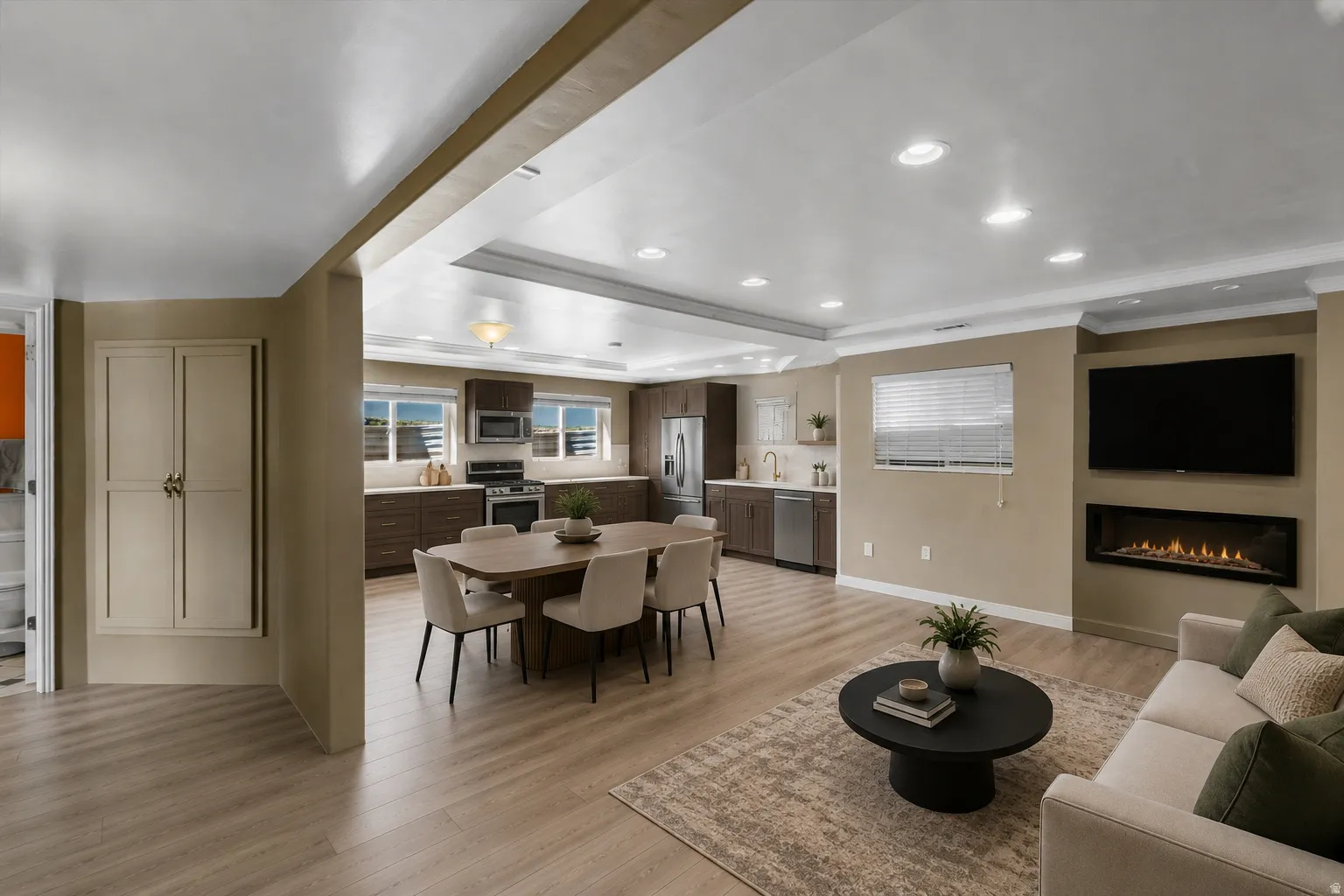 Sketch of basement with open concept living space featuring wood-finish flooring, recessed lighting, and a linear fireplace. Virtually designed and staged.